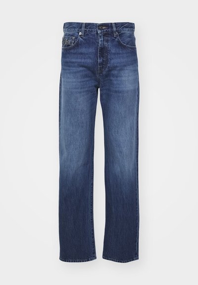 Jeanși din denim albastru cu un design drept, dotati cu un fermoar, cinci buzunare și un finisaj decolorat pe coapse.