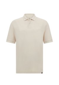 Beige pólotröja med ribbad krage, korta ärmar och en treknapplösning. Har subtila kontrasterande detaljer längs kragens och ärmarnas kanter.