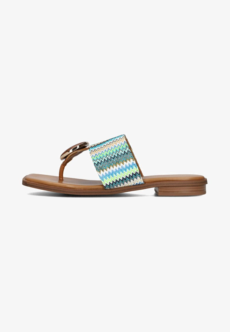Flat sandals with a brown leather sole, featuring a multicolored zigzag woven strap and a decorative circular hardware accent.
