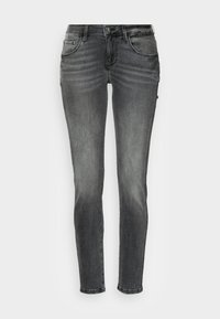 Svarta smala jeans i denim med fem fickor, dragkedja och subtil fading på låren. Slät textur och kroppsnära design.