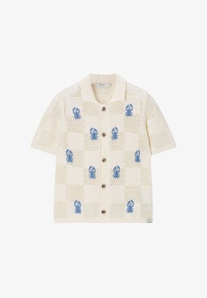 Cardigan en maille crème à manches courtes avec col, boutons en bois, motif en maille ajourée et motifs homards bleus uniformément espacés sur le devant.