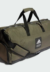 Borsa a tracolla verde oliva con dettagli neri, realizzata in tessuto resistente, dotata di doppie cinghie nere, chiusura con zip e dettaglio del logo.