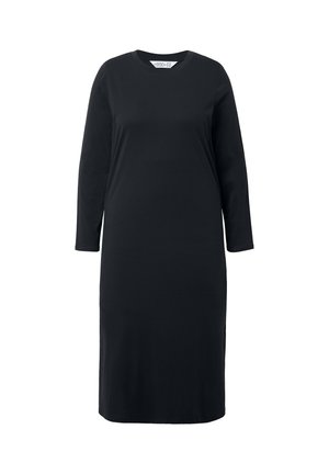 Robe noire à manches longues en tissu doux, avec un col rond et une silhouette droite, atteignant en dessous du genou.