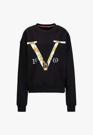 Black sweatshirt with a cropped design, featuring a large white and gold "V" graphic and the year "1969" in white. Soft fabric and ribbed cuffs.