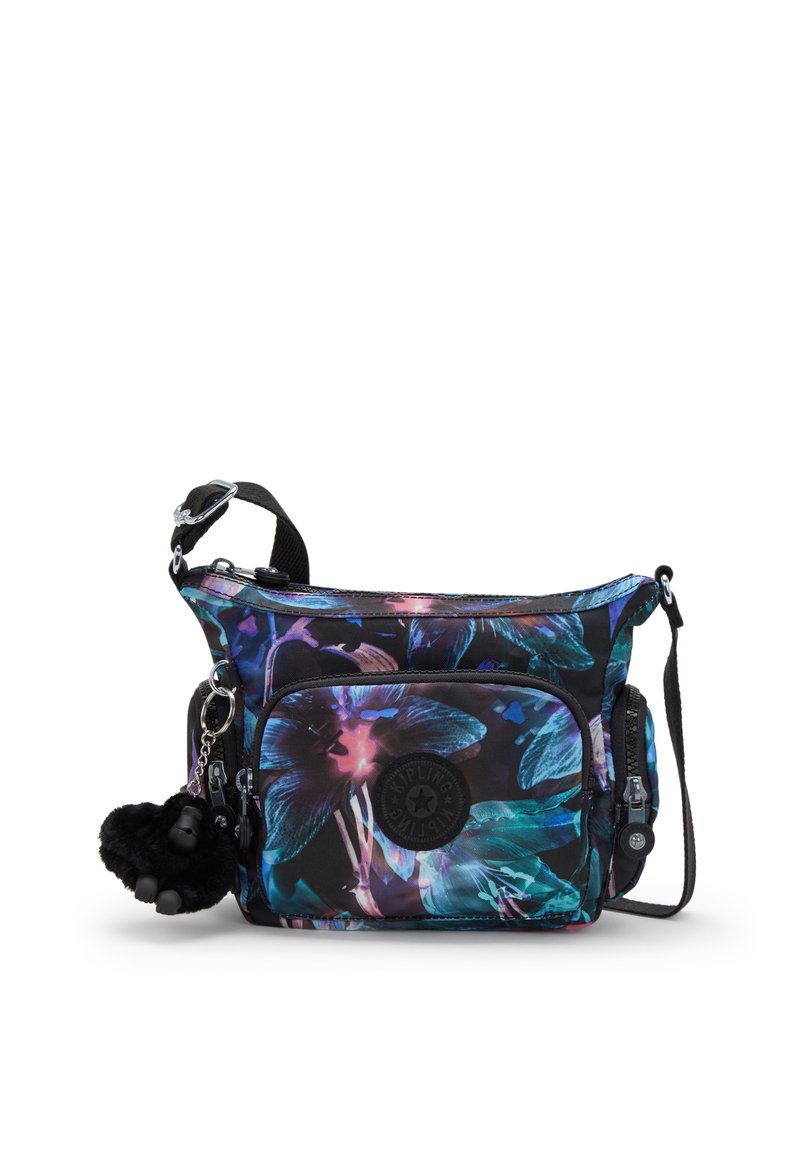Sort crossbody taske med et blomstermotiv i blå, lilla og turkis. Indeholder en frontlomme, justerbar rem og en fluffy pom-pom nøglering.