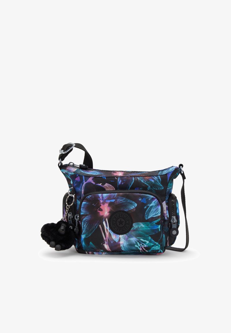 Black crossbody bag with a floral pattern in blue, purple, and teal. Includes a front pocket, adjustable strap, and a furry pom-pom keychain.