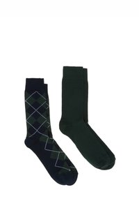 Due paia di calze: una blu navy con un motivo a rombi verdi e l'altra di un verde scuro uniforme. Entrambe presentano una texture liscia e un design tradizionale.