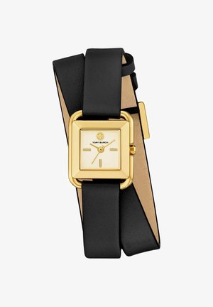 Gold square watch face with minimal markers and logo, paired with a long black leather wrap-around strap.