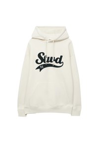 Hoodie blanc cassé avec poche avant, cordons de serrage et texte noir "Stud 91" en gros caractères sur la poitrine.