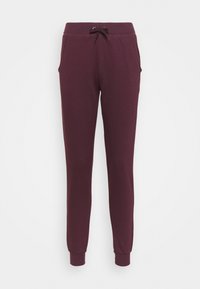 Pantalones de chándal burdeos fabricados en tejido suave, con cintura elástica y cordón, bolsillos laterales y puños ajustados en los tobillos.