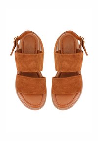 Braune Wildledersandalen mit zwei breiten Riemen und einer Lederinnensohle. Mit einem seitlichen Schnallenverschluss zur Anpassung und abgerundeten Kanten.