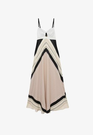 Fehér és fekete ujjatlan maxiruha vékony pántokkal, bézs és fekete árnyalatú geometriai mintás szoknyával.