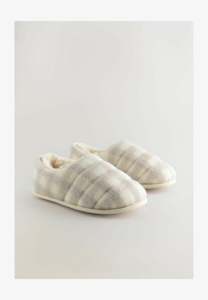 Pantofole a scacchi grigie e crema realizzate in morbido feltro, con un design trapuntato e rivestimento in peluche. Punta arrotondata con suola in gomma minimal.