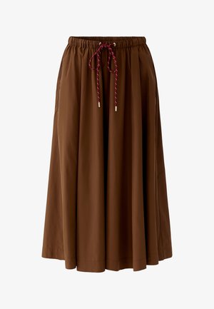 Brown midi skirt with elastic waistband and burgundy drawstring tie, featuring a relaxed, flowing fit and side pockets.