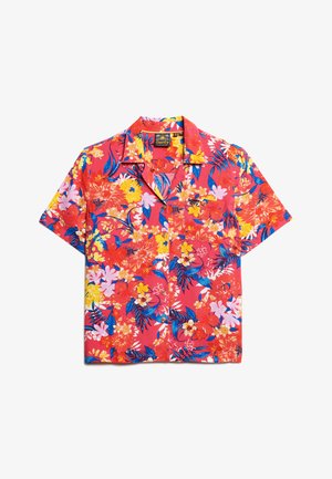 Chemise à manches courtes à boutons avec un fond rouge vif et des motifs floraux multicolores en jaune, rose et bleu.