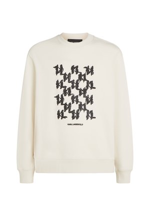 Hanorac de culoare crem, cu un model grafic repetat negru și textul "KARL LAGERFELD" în partea de jos. Textură moale, manșete din țesătură ribbed.