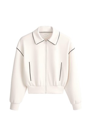 Biela bunda na zips s čiernym lemovaním na golieri, rukávoch a vreckách, s rebrovanými manžetami a pásom.