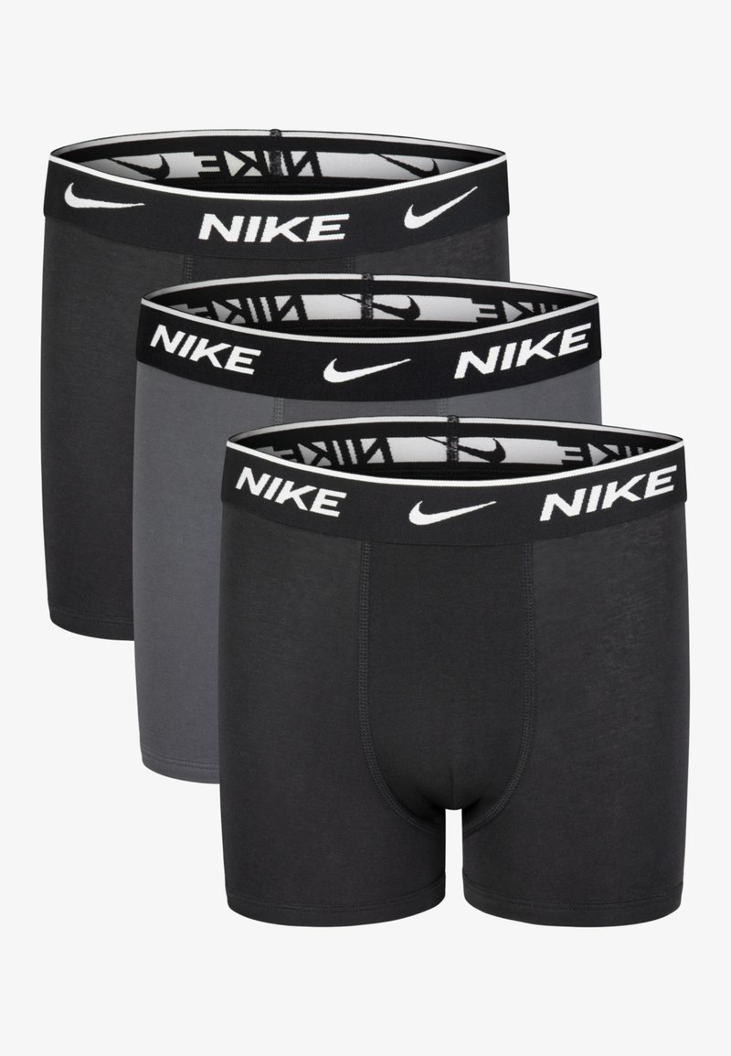 Nike moške bokserske hlačke v črni in sivi barvi, z elastičnim pasom z logotipom, raztegljivim materialom, prilegnjeno zasnovo in brezšivnimi robovi.