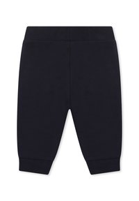 Pantalon en coton bleu marine avec une taille et des poignets côtelés, présentant une texture lisse et une coupe fuselée. Aucun motif ni accent visible.