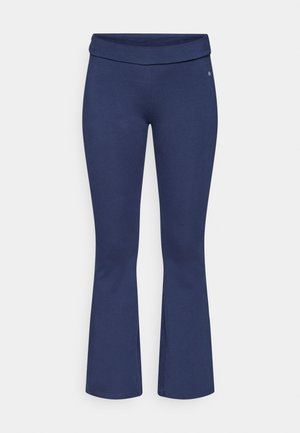 Navy blue flared leggings with a wide, folded waistband. Made from a soft, stretchy material. Features no visible branding or patterns.