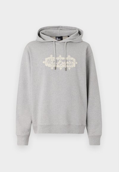 Harmaa huppari, joka on valmistettu puuvillasekoitteesta ja jossa on edessä off-white-värinen teksti ja koristeellinen kuvio. Sisältää nyörit ja ribattuja hihansuita.