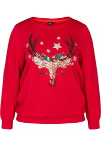 Rode sweater met lange mouwen en een sequentrendierdesign met gewei, een rode neus en zilveren sterren. Zachte stof met een ontspannen pasvorm.