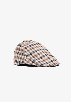 Cappellino piatto con motivo a quadri nei colori beige, marrone, blu navy e crema, mostrato su sfondo bianco.