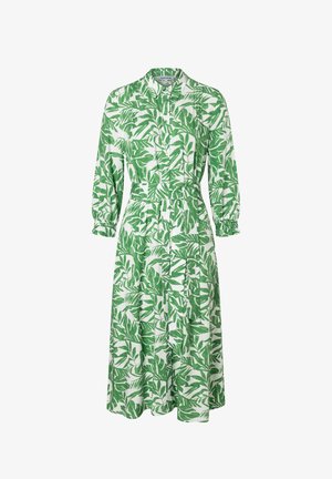Robe midi blanche à manches longues, motif de feuilles vertes, boutonnage sur le devant, col et ceinture assortie en tissu à la taille.
