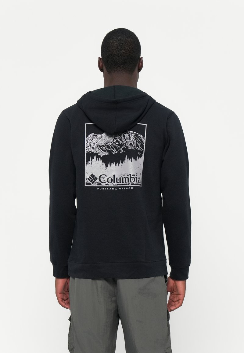 Felpa nera con cappuccio e grafica di montagna bianca sulla schiena. Presenta un cappuccio con coulisse e polsini a costine, realizzata in tessuto morbido.