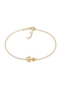 Bracelet en chaîne en or avec un pendentif en forme d'ancre, maillons texturés et fermoir en lobster. Comprend trois options de longueur ajustable.