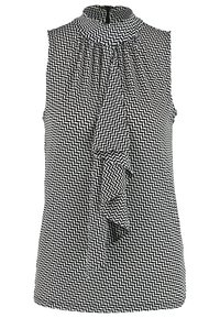 Blouse sans manches à motif chevron noir et blanc, col montant et détail volanté à l'avant.