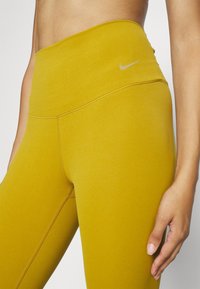 Nike Performance Leggings - dark yellow