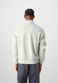 Lacoste Tröja med dragkedja - stone