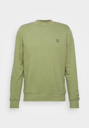Lichtgroene lange mouw crewneck trui met geribbelde boorden en zoom, met een klein Calvin Klein-logo op de linkerborst.
