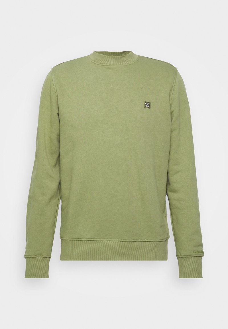 Sweat-shirt vert clair à manches longues avec encolure ronde, poignets et ourlet côtelés, arborant un petit logo Calvin Klein sur le côté gauche de la poitrine.