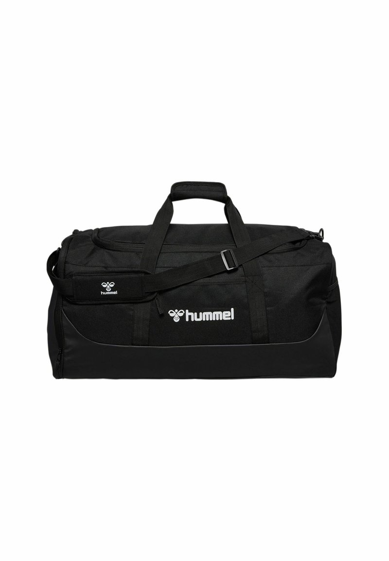 Black duffel bag made of durable fabric. Features adjustable shoulder strap, dual handles, and prominent white logo. Zippered main compartment.