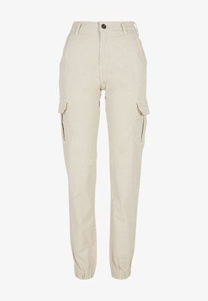 Béžové cargo nohavice s priliehavým pásom, elastickými manžetami, bočnými vreckami a zapínaním na gombík. Vyrobené z bavlny s hladkou textúrou.