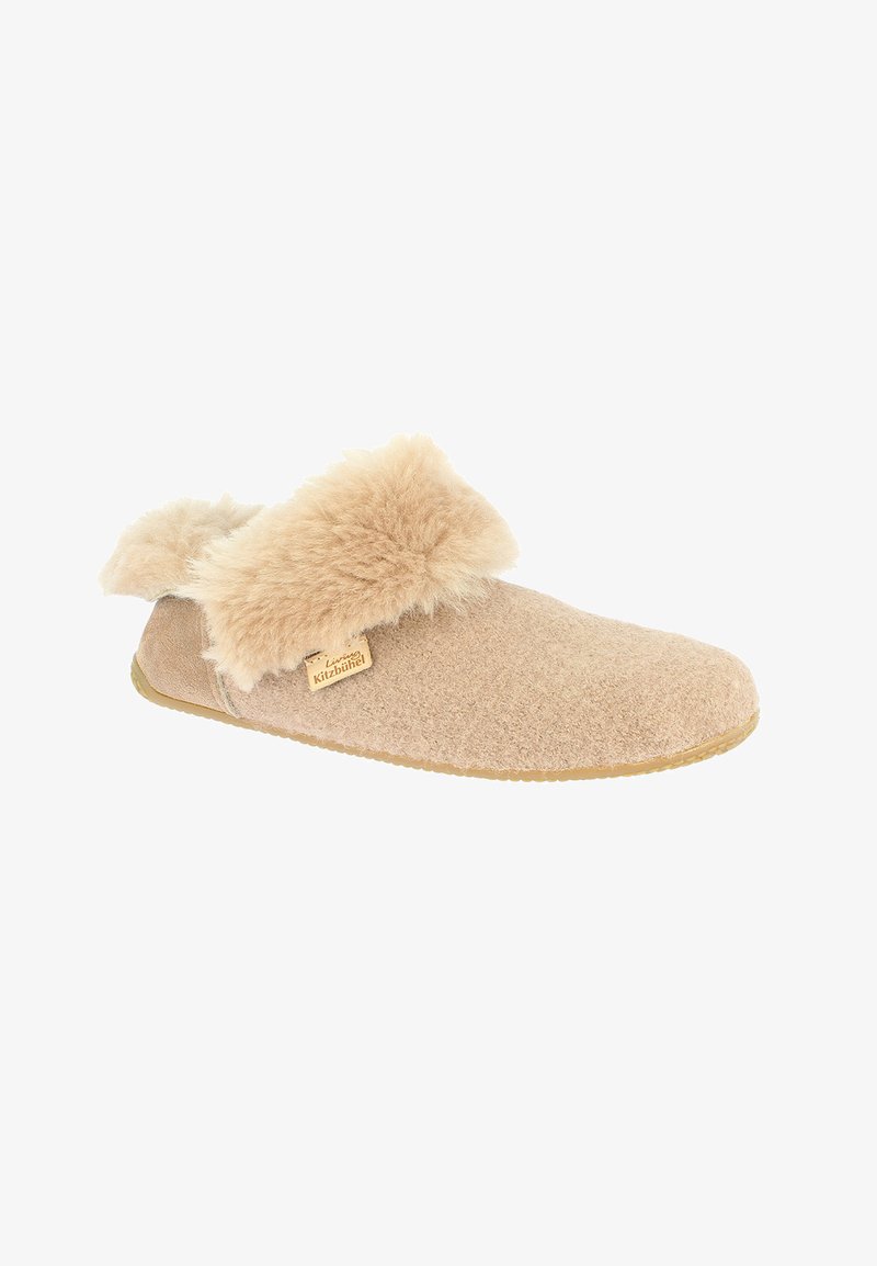 Beige toffel i ull med en krage i konstgjord päls, platt sula, rund tå och en märkesetikett på sidan. Mjuk textur och varm design.