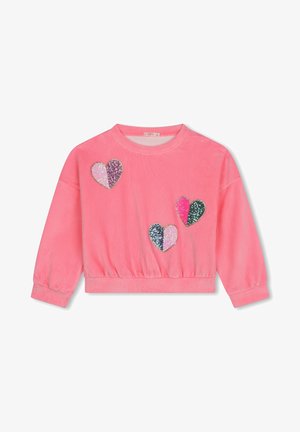 Sweatshirt rose avec un col rond côtelé et un ourlet élastique. Présente quatre appliqués en forme de cœur scintillants cousus avec des couleurs et motifs variés.