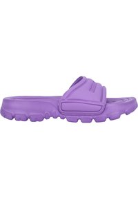 Purple rubber slide sandal featuring a wide strap and textured outsole with small, raised sections for grip. Lightweight and flexible design.