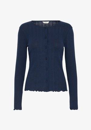 Mørkeblå cardigan lavet af ribbet stof, med en rund halsudskæring, syv knapper foran og en bølget kant ved ærmerne.