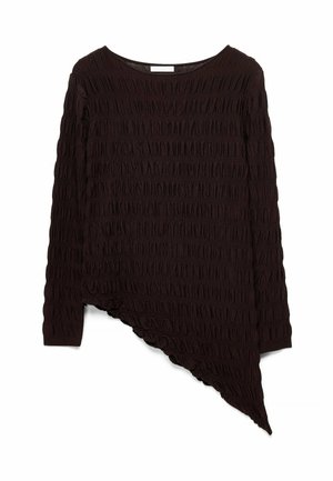 Black long-sleeve top with textured fabric and an asymmetrical hemline slanting downward on the right side.