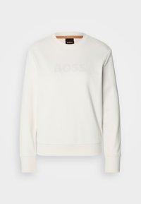 Sweat-shirt blanc à manches longues avec col rond, logo "BOSS" discrètement embossé sur la poitrine, poignets et ourlet côtelés.