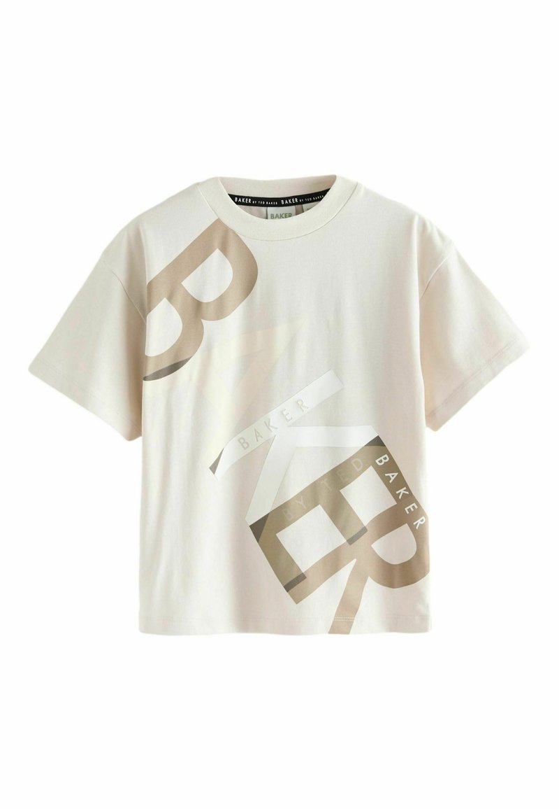 T-shirt couleur crème en coton doux, avec de grands graphismes textuels superposés en beige et blanc, col rond et manches courtes.