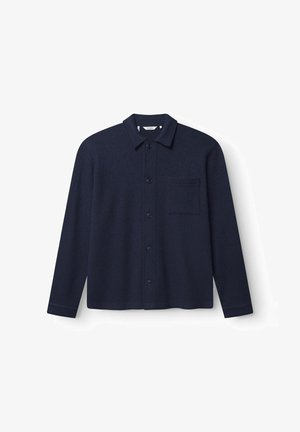 Navy blue button-up shirt in wool blend, featuring a point collar, long sleeves, and a chest pocket with a textured fabric finish.
