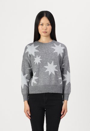 Gray knitted sweater featuring white star patterns, round neckline, ribbed cuffs and hem, relaxed fit. Worn with black pants.