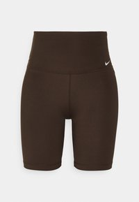 Hnědé sportovní šortky s vysokým pasem, vyrobené z hladké látky. Na pasu je malý bílý nápis Nike.