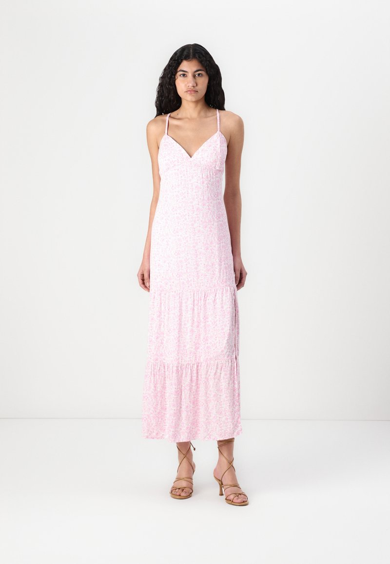 Pink floral maxi dress with spaghetti straps, a V-neckline, and tiered ruffles at the hem. Lightweight fabric with subtle texture.