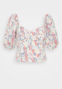 Blusa com estampa floral e mangas curtas bufantes. Feita de um tecido leve em cores pastel: rosa, azul e bege. Corpete ajustado com decote em forma de coração.