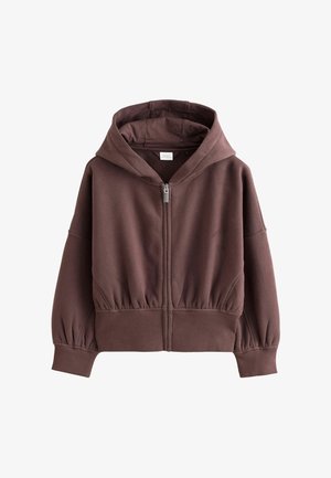 Bruine hoodie met rits en grote capuchon, geribde boorden en zoom, gemaakt van zachte stof, weergegeven op een witte achtergrond.